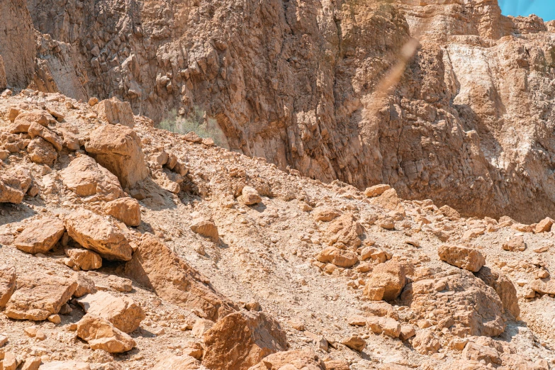 the peaks of a mountain side with rocky terrain