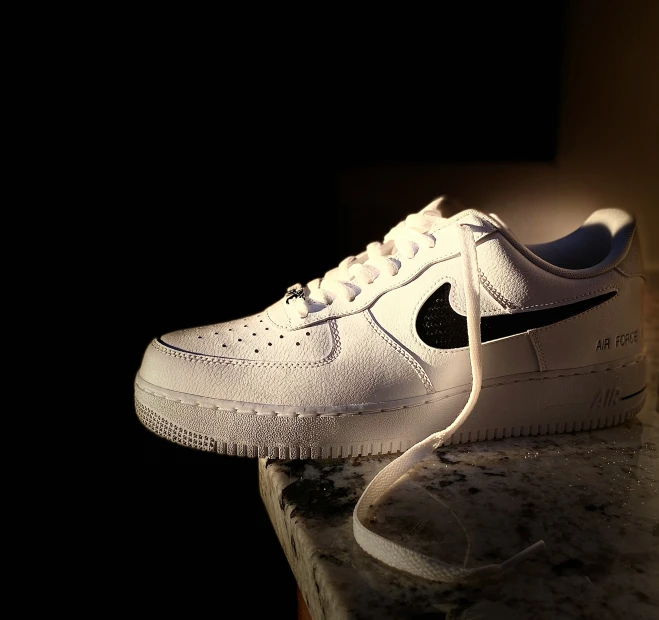 an unlit nike air force 1 is on a table