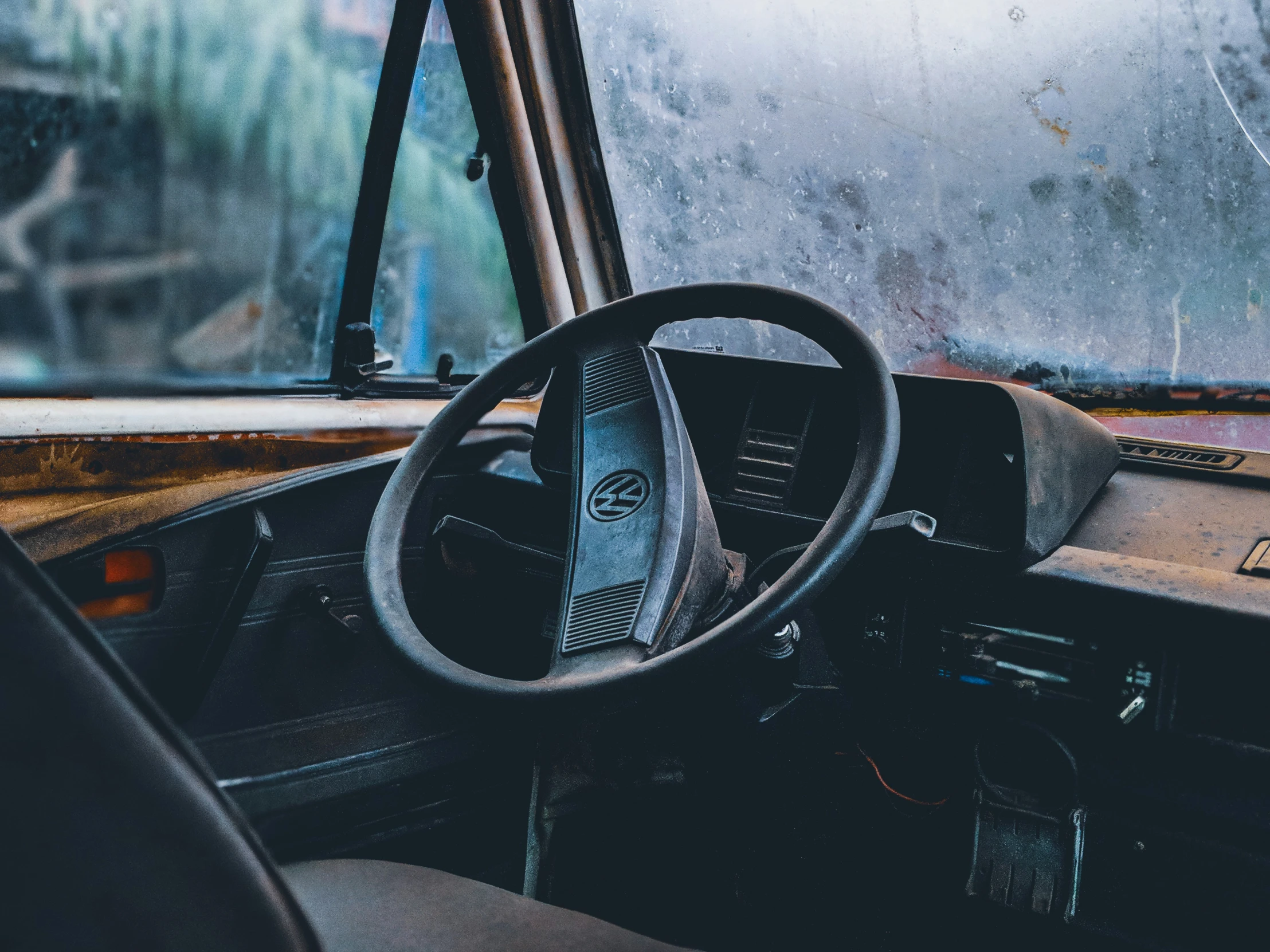 an old car interior, with a dash light and dashboard