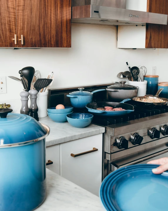 the pots and pans are sitting on the stove