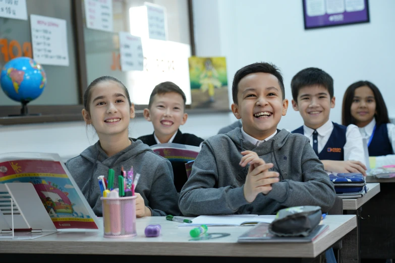 a group of children sitting next to each other