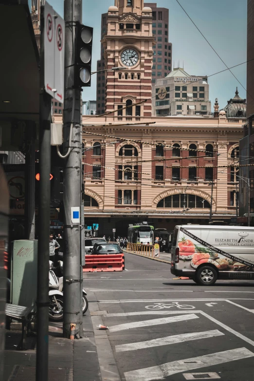 a traffic light that has a bus sitting below it