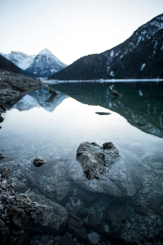 a beautiful lake surrounded by some rocky mountains