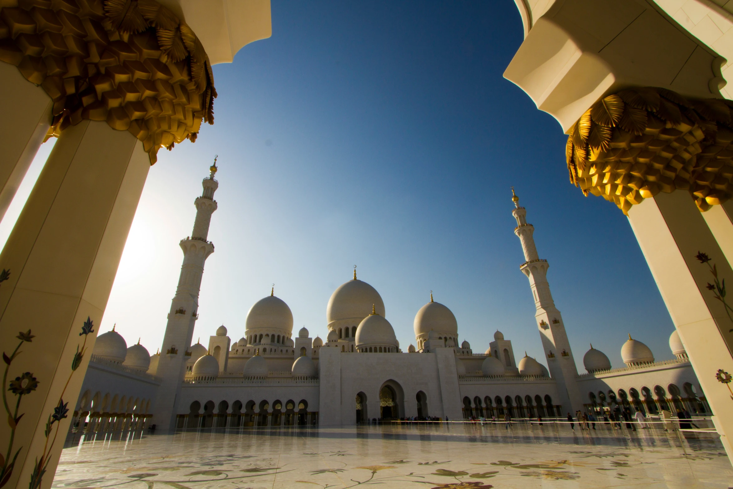 looking out from the courtyard towards a mosque