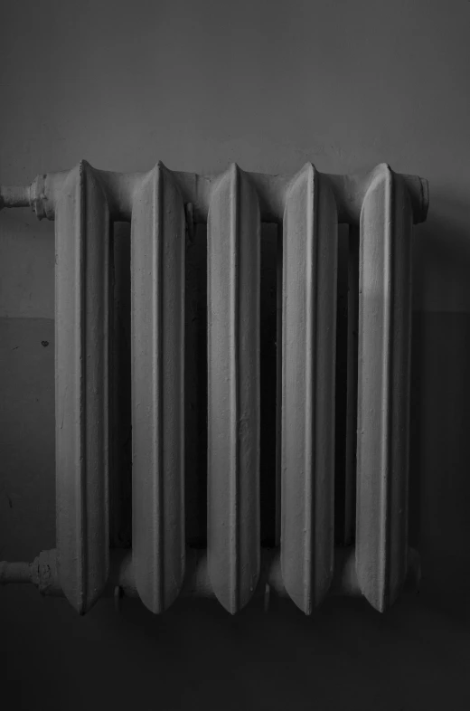 a radiator and an electrical wire connected to a wall