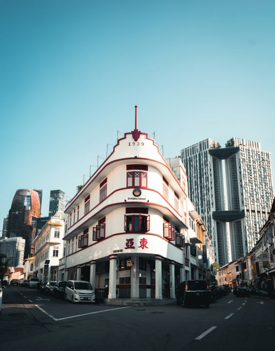 a building on a corner that has asian writing in it