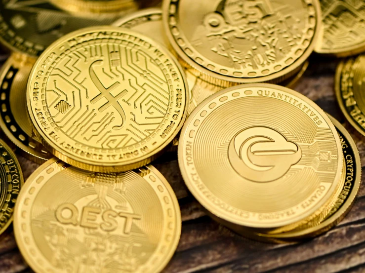 pile of golden coin on wooden surface, closeup