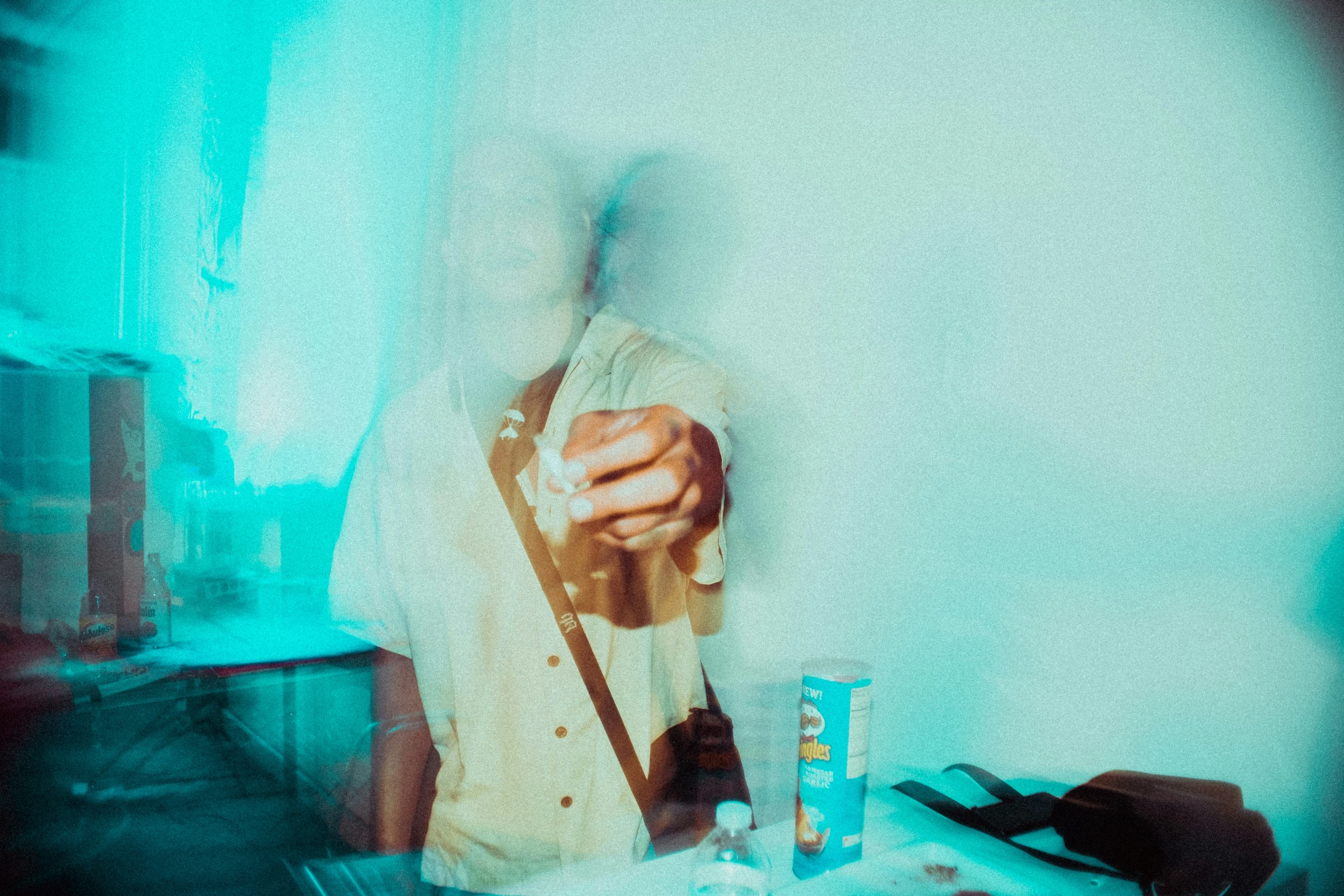 man in white shirt playing an electric guitar