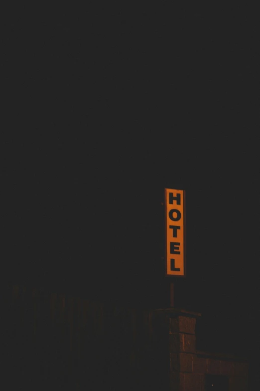 a sign is lit up in the dark