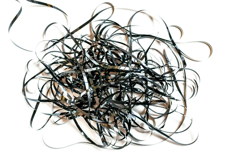 a group of black and brown pieces of string