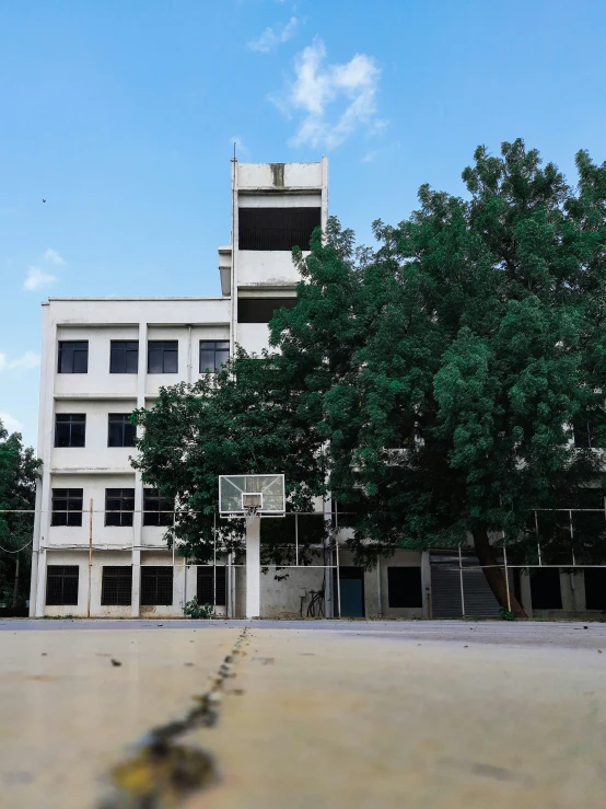 the large concrete building with an open parking lot