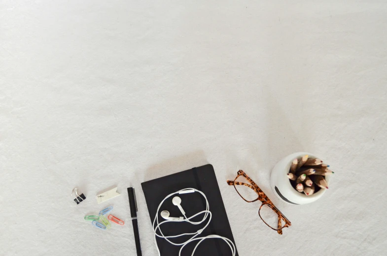 a table with various items on it including some books