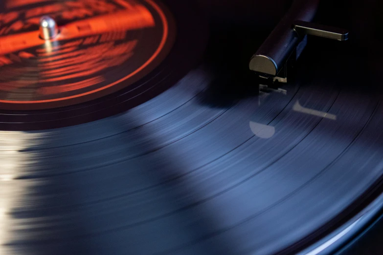 a turntable that has a black and silver design on it