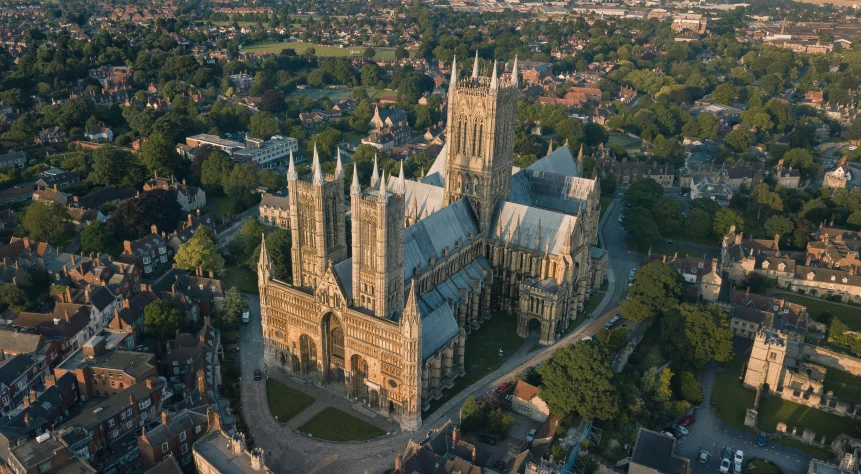 an aerial view of a city with a church