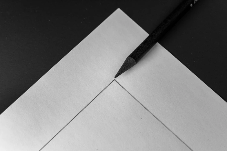 a pen rests on an envelope as it rests on the floor