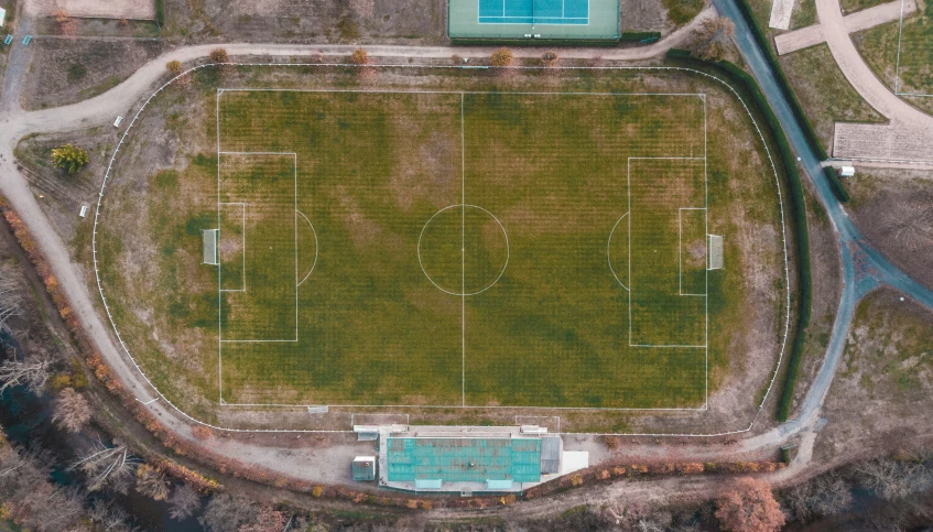 an overhead s of a sports field with a soccer goal