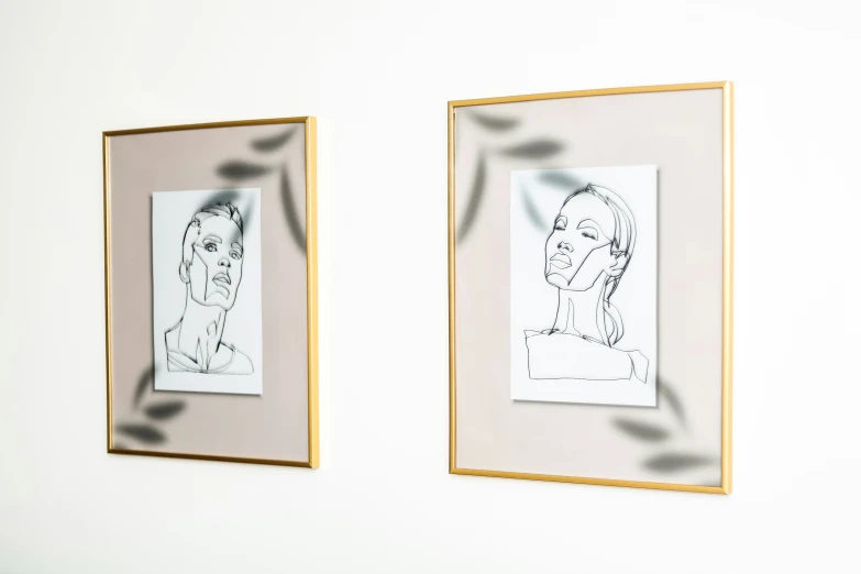 two frames holding a drawing next to each other