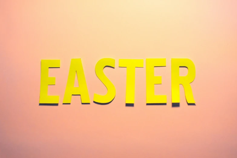 the word easter written with sticky stickers on a wall