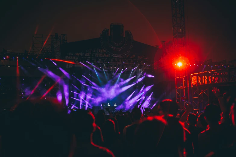 a concert scene with a large band on stage