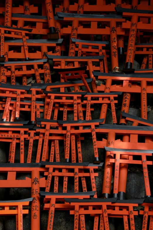 lots of red asian style benches are arranged