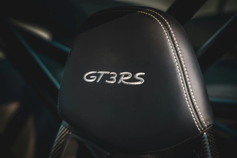 a black motorcycle seat with the gmbs lettering on it