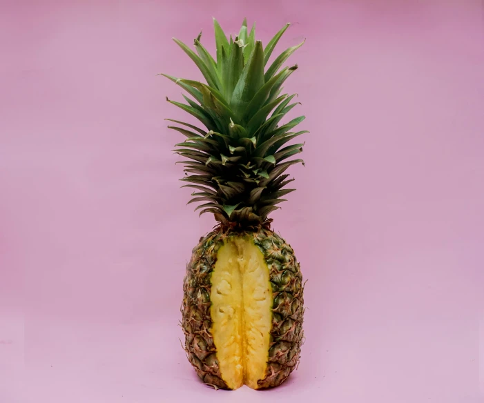 the fruit is laying in front of a pink background