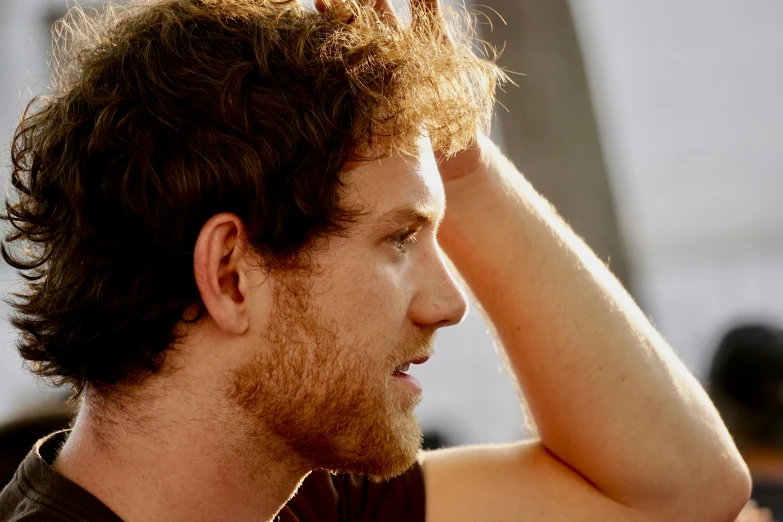 a close up image of a person putting on some kind of ear plugs