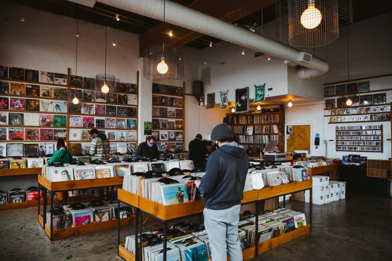 people browse through records at a book store