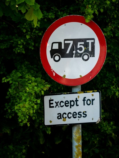 a sign that is on the street saying expect for access