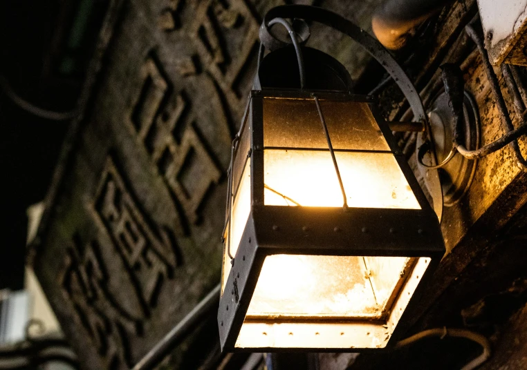 a street lamp is sitting next to an iron building