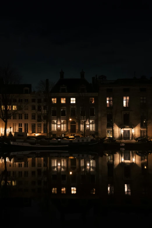 an image of a city at night by water