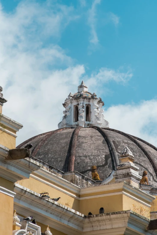 the roof of an old building with decorative designs on top