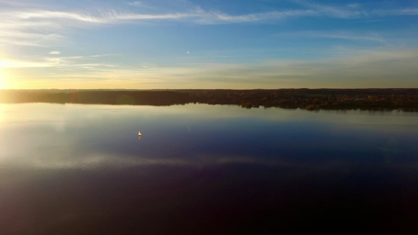 the view from a plane looking at a lake with some water