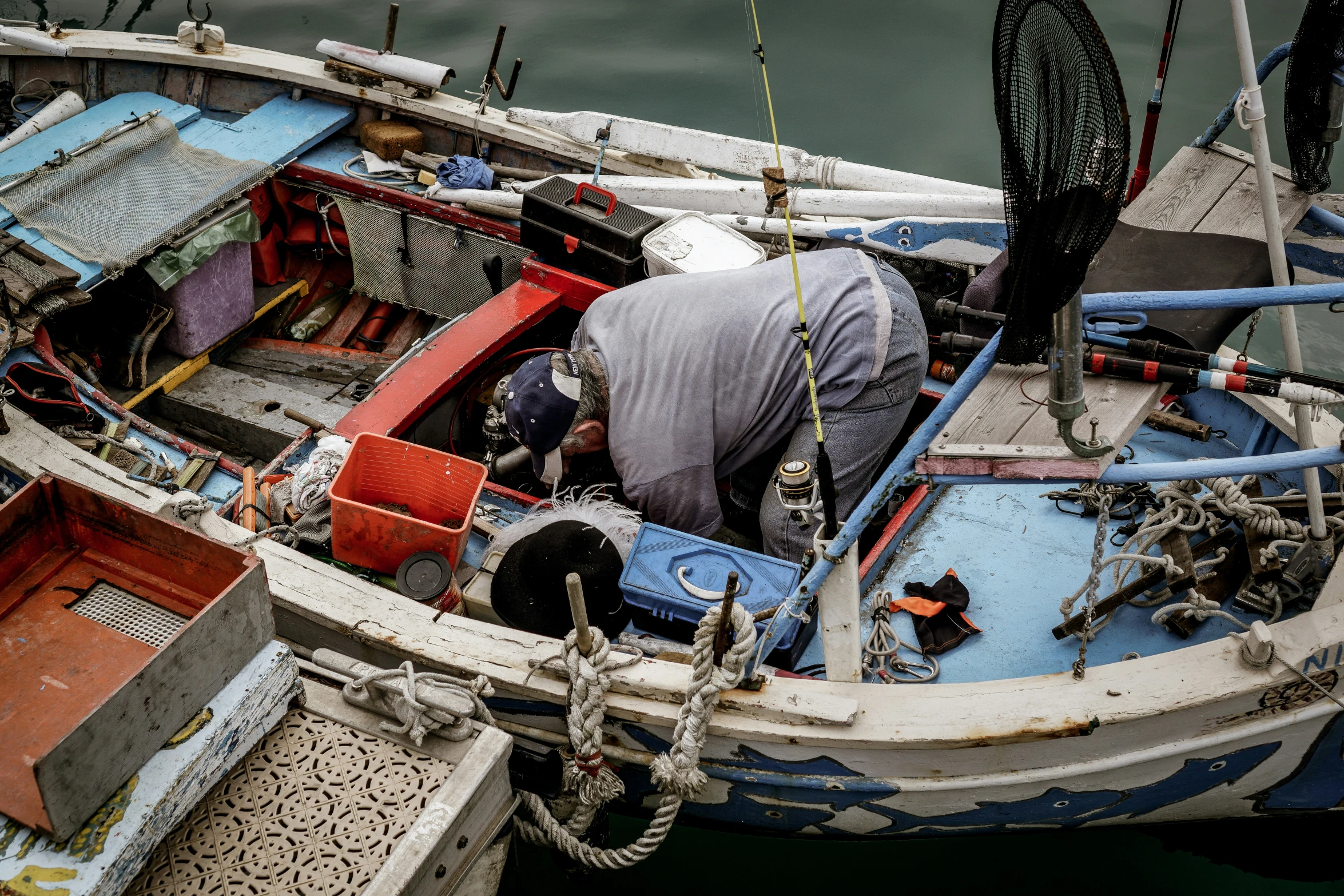 the bow of a small boat on a body of water