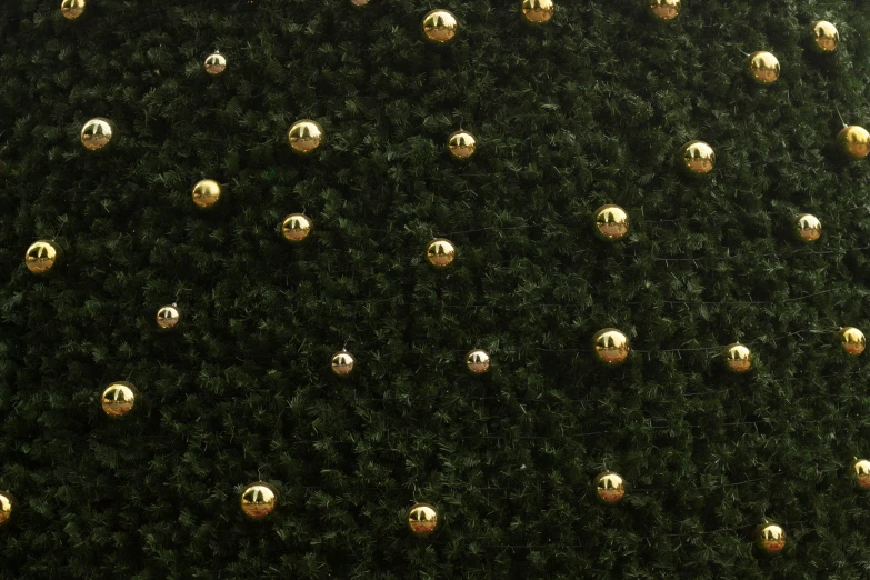 golden metal balls are on the green surface