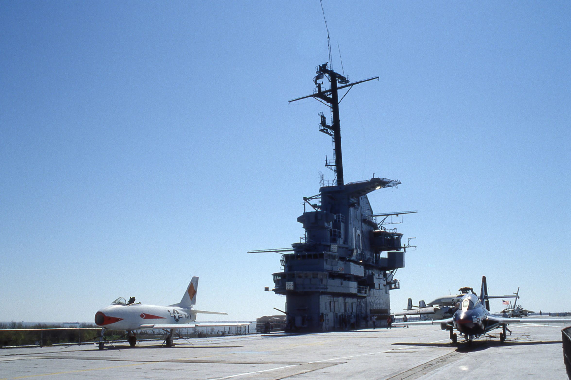 a large aircraft carrier sitting on top of an airport tarmac