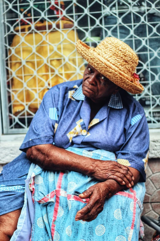 a woman sitting on a bench with her feet on the table