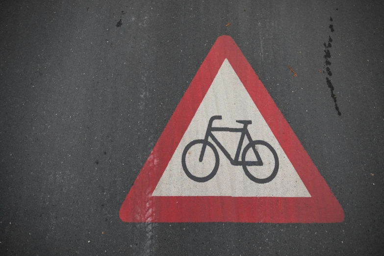 a close up of a street sign with bikes