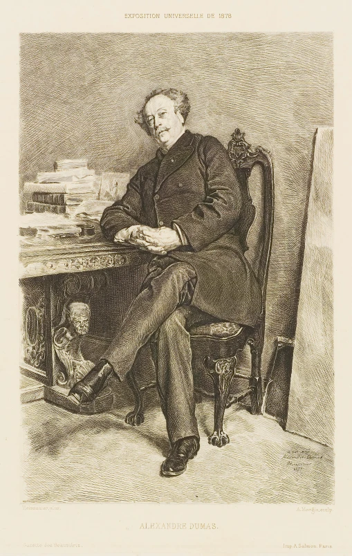 a man sitting in a chair near a table