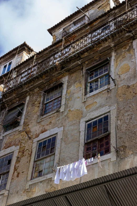 an old building with laundry hanging out to dry