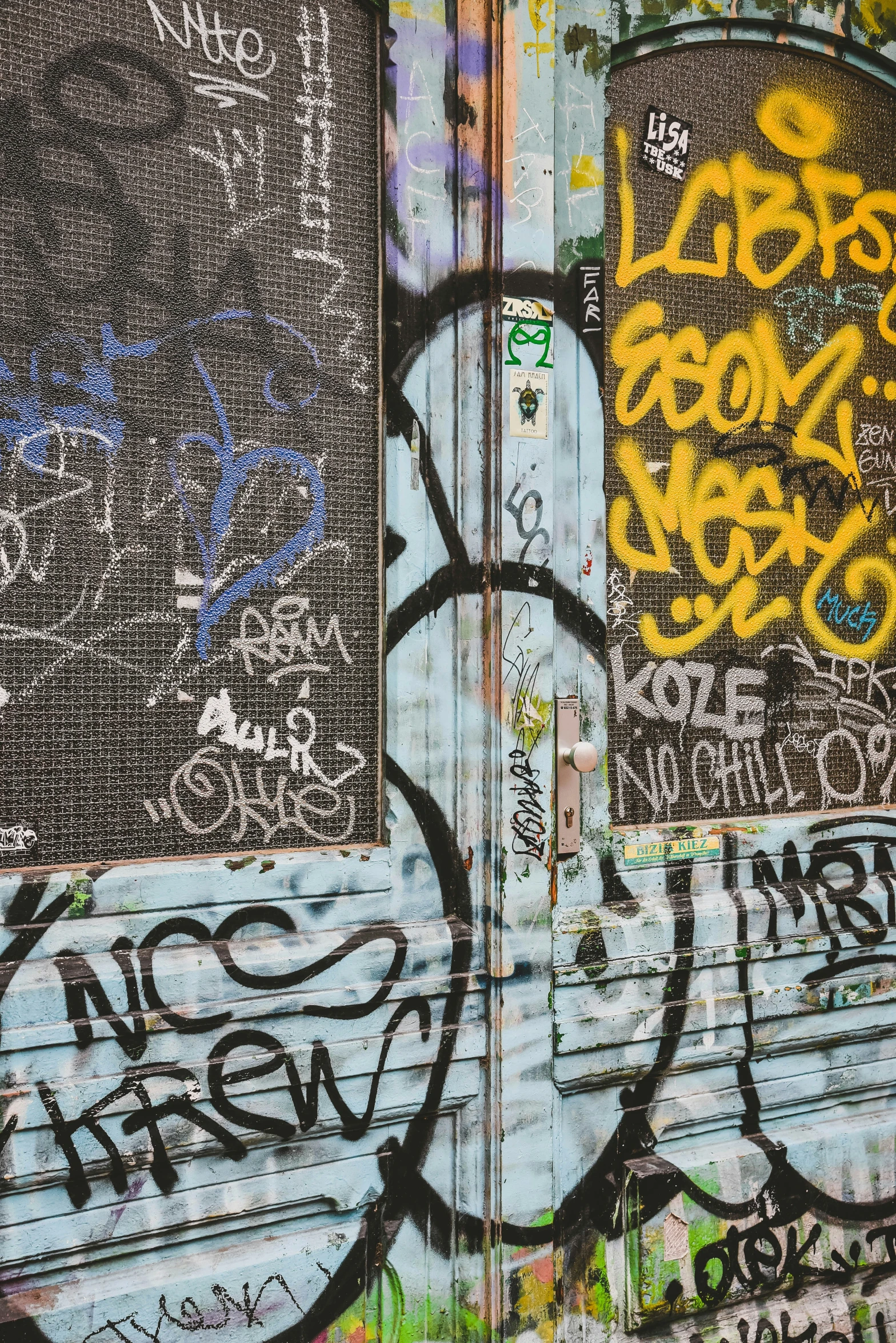 the corner of an overpass has been tagged with graffiti