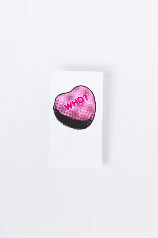 a heart - shaped candy - covered chocolate in front of white background
