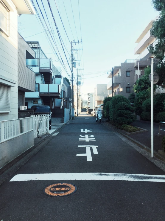 the streets and buildings are all made of wood and have graffiti on them