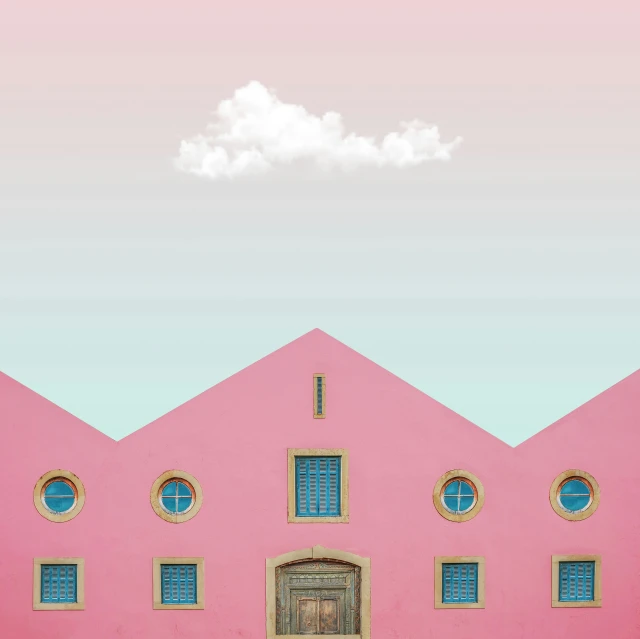 a pink building with four windows and a door
