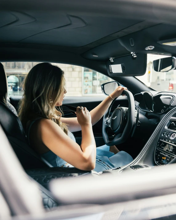 a young woman sitting in a car while driving