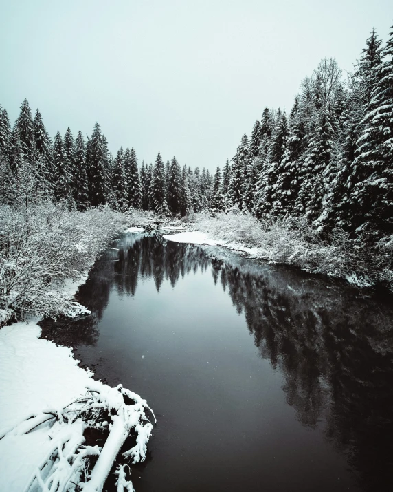 an empty creek in a snowy area