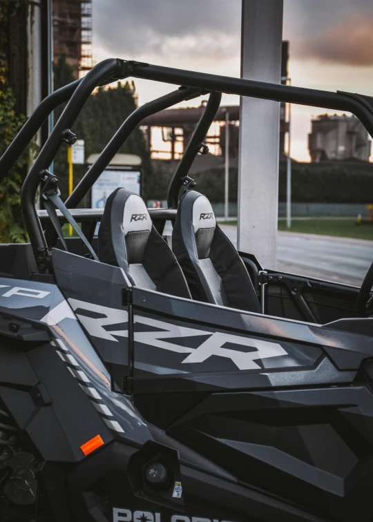 the two seat side - by - side race buggy is parked