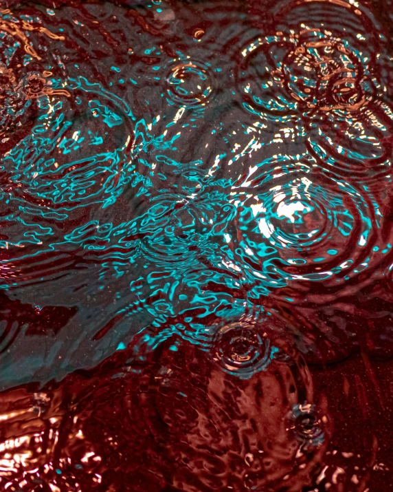 blue and red color of water is reflected on the surface
