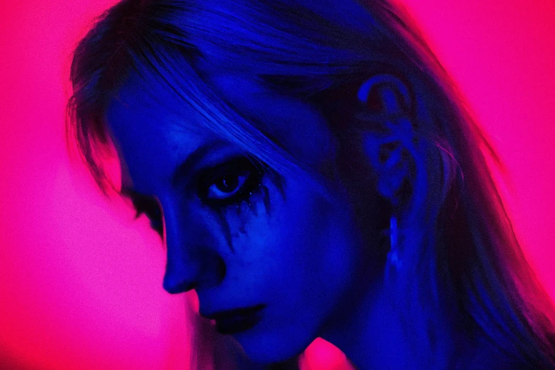 an image of a woman wearing neon colored makeup