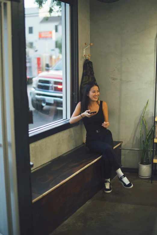 an image of woman on bench in city setting